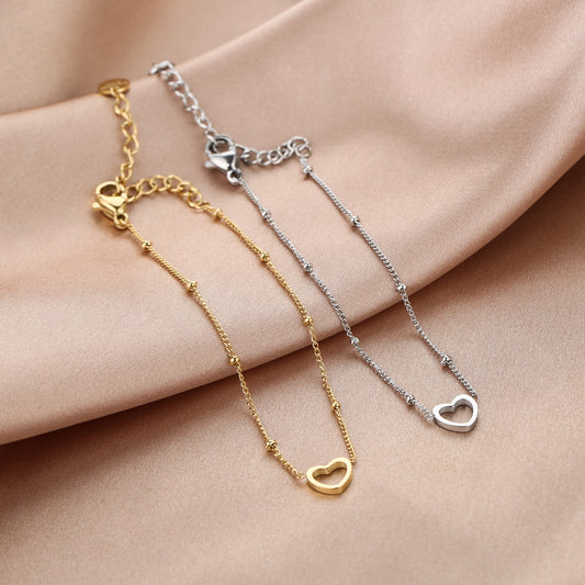 Armband open hartje met bolletjes